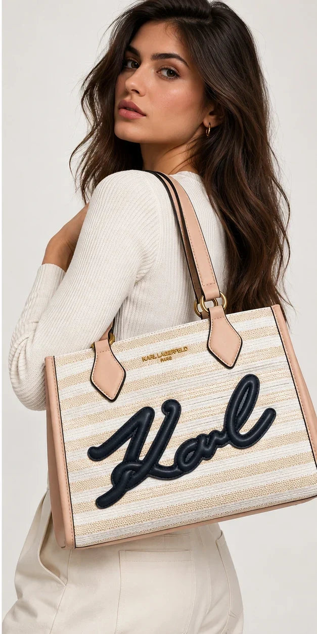Karl Lagerfeld Paris pink and white tote bag worn by model